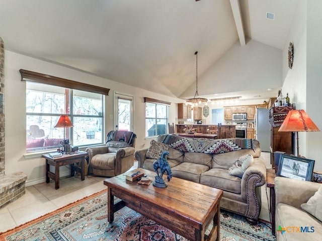 1777 Crossbow Dr, Canyon Lake, TX 78133 - living area with visible vents, beam ceiling, light tile patterned flooring, and high vaulted ceiling