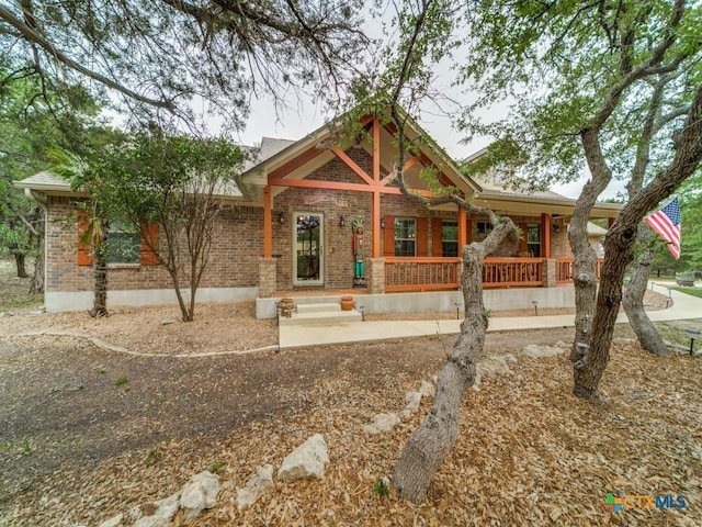 1777 Crossbow Dr, Canyon Lake, TX 78133 - view of front of house featuring a porch and brick siding