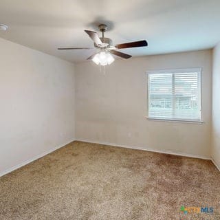 5120 Siltstone Loop, Killeen, TX 76542 - carpeted spare room featuring ceiling fan and baseboards
