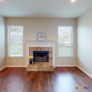 5120 Siltstone Loop, Killeen, TX 76542 - unfurnished living room featuring baseboards, wood finished floors, and recessed lighting