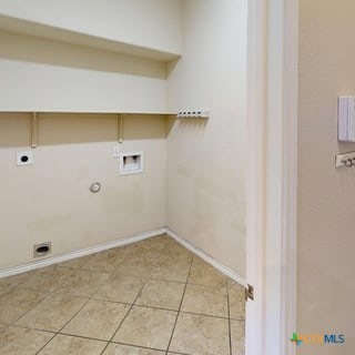 5120 Siltstone Loop, Killeen, TX 76542 - washroom featuring electric dryer hookup, hookup for a washing machine, gas dryer hookup, baseboards, and light tile patterned flooring