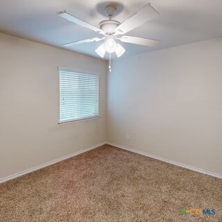 5120 Siltstone Loop, Killeen, TX 76542 - spare room featuring carpet floors and baseboards