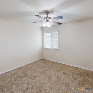 5120 Siltstone Loop, Killeen, TX 76542 - spare room with a ceiling fan, carpet flooring, and baseboards