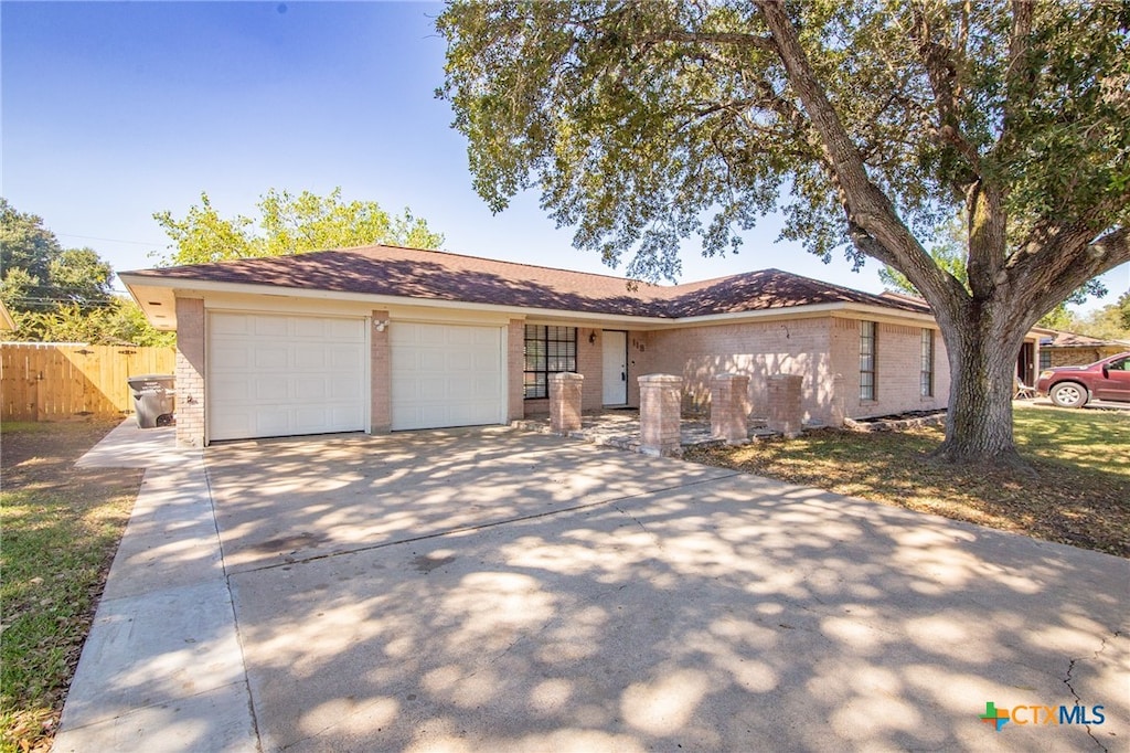 single story home featuring a garage