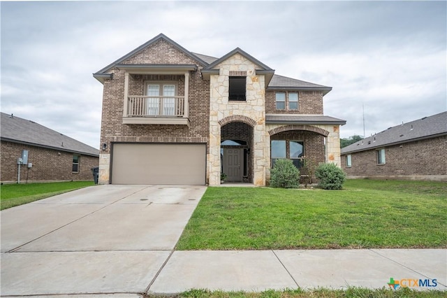 311 Danielle Dr, Killeen, TX 76542 - french provincial home featuring an attached garage, brick siding, driveway, and a front lawn