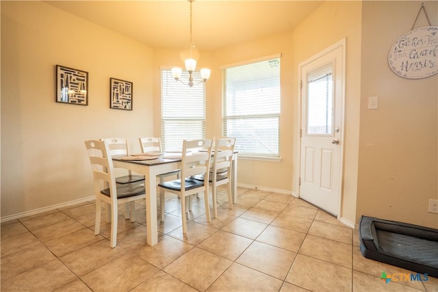 311 Danielle Dr, Killeen, TX 76542 - dining room with a chandelier, baseboards, and light tile patterned flooring