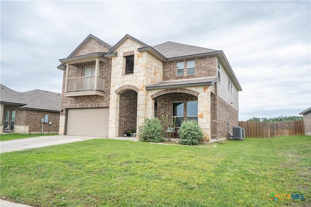 311 Danielle Dr, Killeen, TX 76542 - french provincial home featuring brick siding, an attached garage, stone siding, driveway, and a balcony