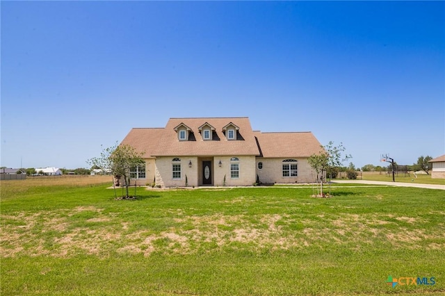 490 Wellspring Blvd, Victoria, TX 77904 - new england style home featuring a front lawn