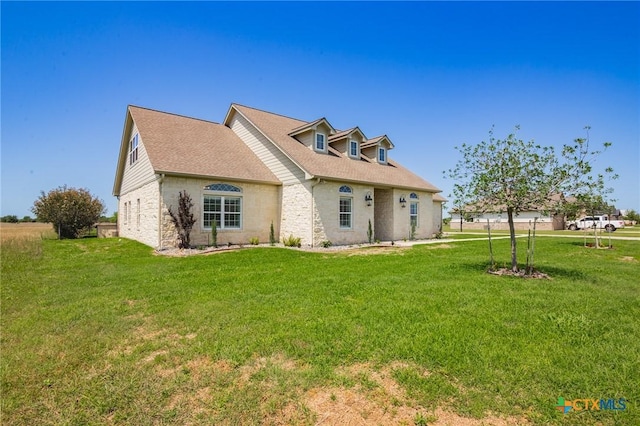490 Wellspring Blvd, Victoria, TX 77904 - back of property with a lawn and roof with shingles