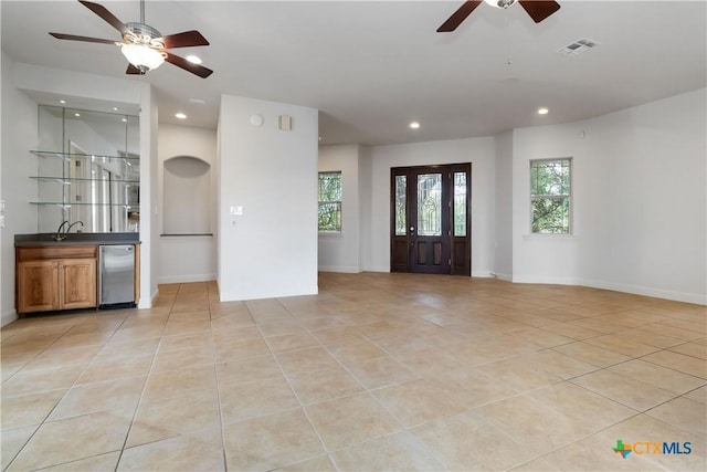 211 Scarlett Ridge Dr, Boerne, TX 78006 - entrance foyer featuring a ceiling fan, recessed lighting, light tile patterned floors, and bar area