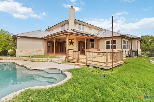211 Scarlett Ridge Dr, Boerne, TX 78006 - rear view of property featuring a wooden deck, an outdoor pool, stucco siding, ceiling fan, and stone siding