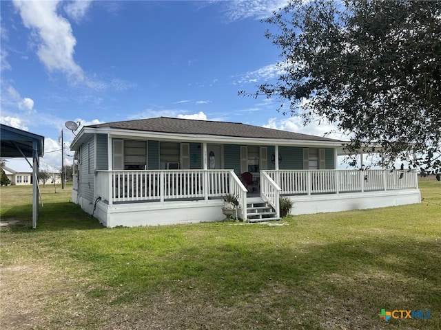 view of front of home featuring crawl space, covered porch, roof with shingles, and a front yard