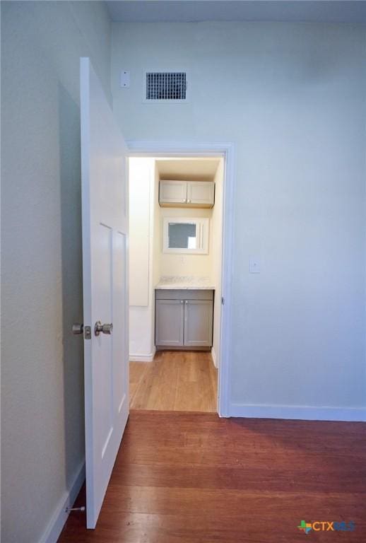 corridor featuring light hardwood / wood-style floors