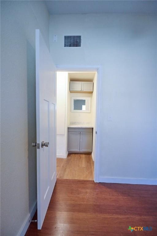 hallway featuring light hardwood / wood-style flooring