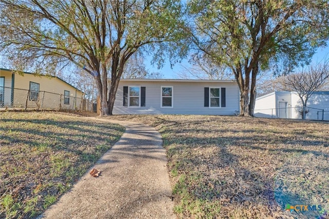 ranch-style house with a front yard