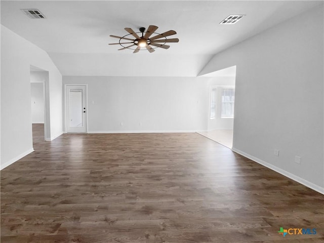 spare room with dark hardwood / wood-style flooring, ceiling fan, and lofted ceiling