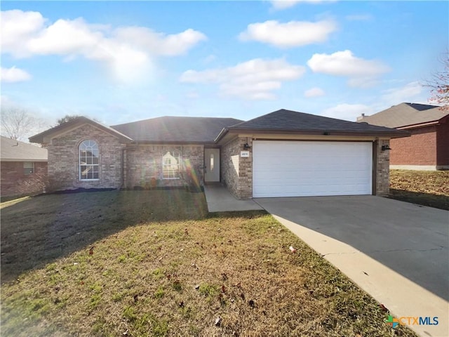 single story home with a front yard and a garage