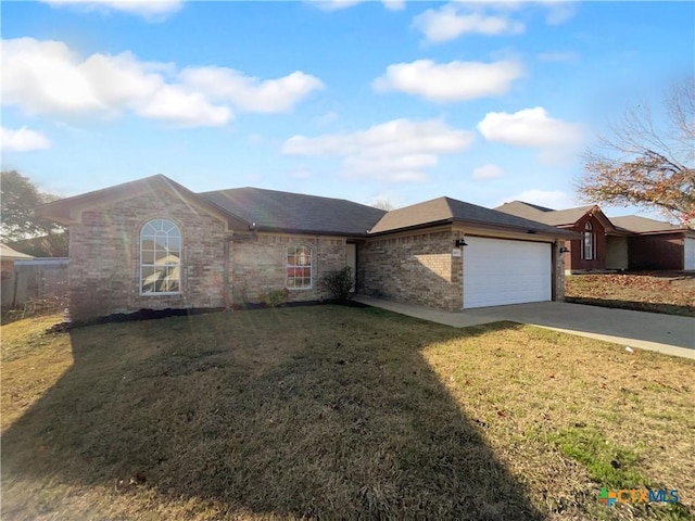 single story home with a front yard and a garage