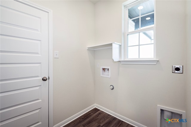 217 Alcatraz Loop, Jarrell, TX 76537 - laundry room featuring hookup for an electric dryer, hookup for a washing machine, dark wood-style floors, baseboards, and hookup for a gas dryer