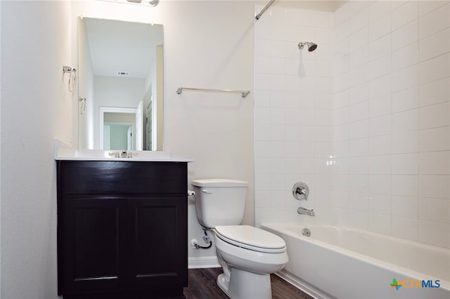 217 Alcatraz Loop, Jarrell, TX 76537 - full bathroom featuring toilet, vanity, wood finished floors, and bathing tub / shower combination