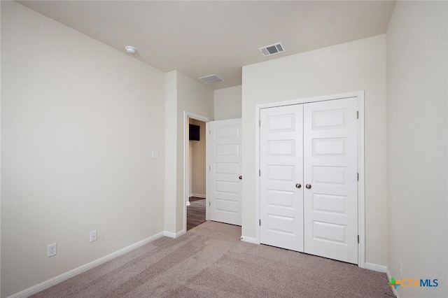 217 Alcatraz Loop, Jarrell, TX 76537 - unfurnished bedroom featuring carpet flooring, baseboards, and a closet