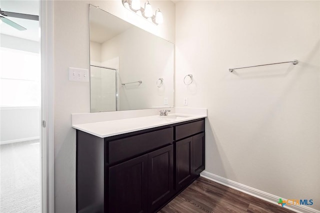 217 Alcatraz Loop, Jarrell, TX 76537 - full bath with vanity, a shower, wood finished floors, baseboards, and a ceiling fan