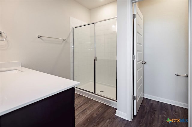 217 Alcatraz Loop, Jarrell, TX 76537 - full bathroom featuring a shower stall, vanity, wood finished floors, and baseboards