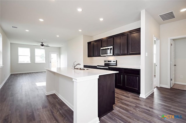 217 Alcatraz Loop, Jarrell, TX 76537 - kitchen with appliances with stainless steel finishes, a sink, a ceiling fan, baseboards, and recessed lighting