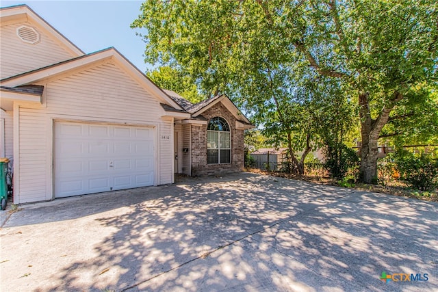 view of front of property featuring a garage