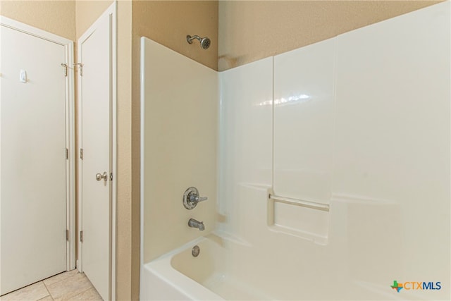 bathroom with tile patterned floors and bathing tub / shower combination