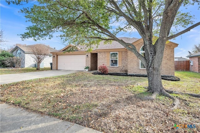 ranch-style house featuring a garage and a front lawn