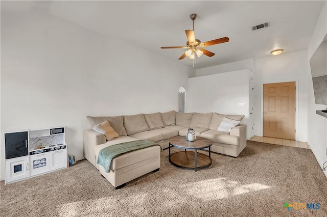 carpeted living room featuring ceiling fan