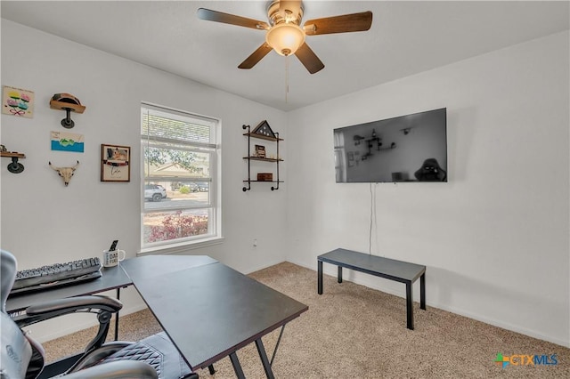 home office featuring ceiling fan and light colored carpet