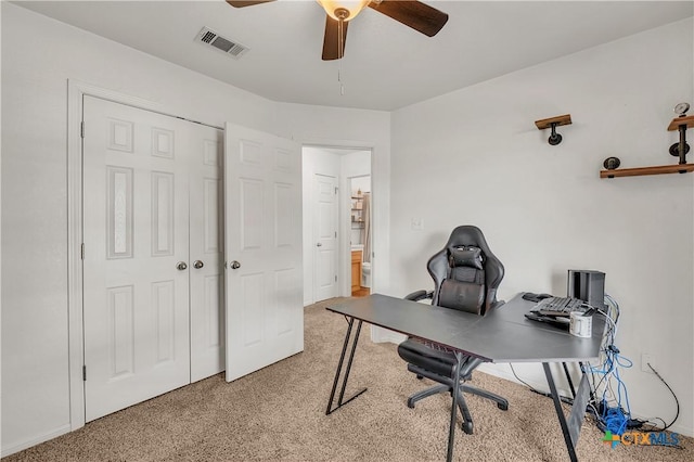 carpeted office with ceiling fan