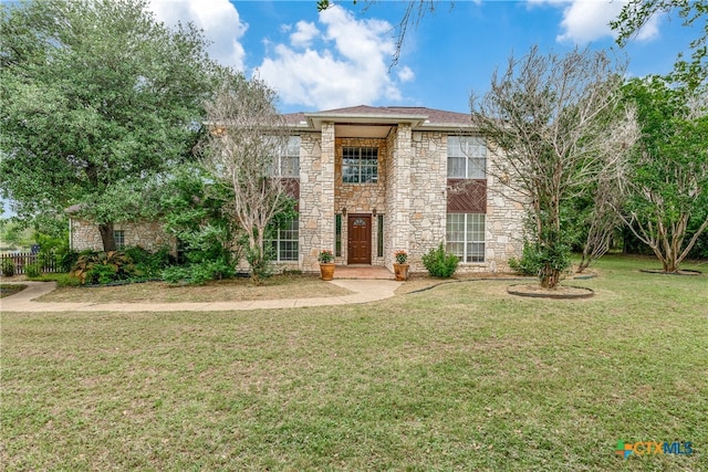 view of front of home with a front lawn