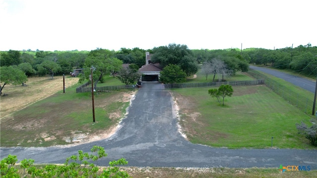 birds eye view of property featuring a rural view