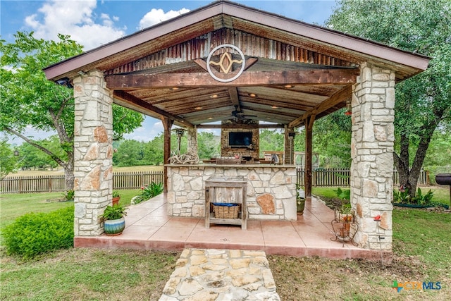 view of patio / terrace with a gazebo and a fireplace