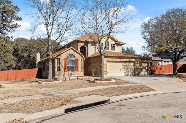 view of front of home with driveway, stone siding, fence, and brick siding