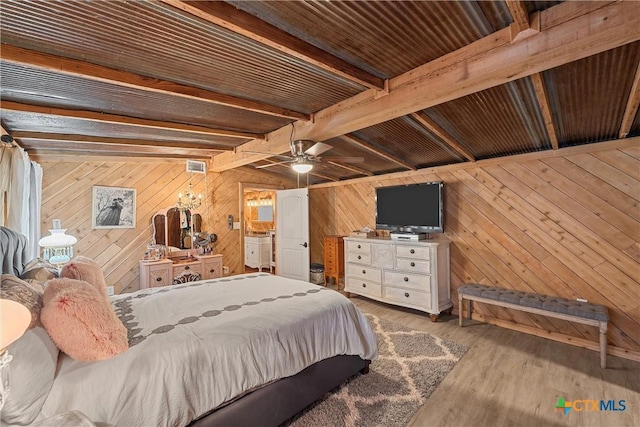 bedroom with beamed ceiling, light hardwood / wood-style flooring, ceiling fan, and wood ceiling