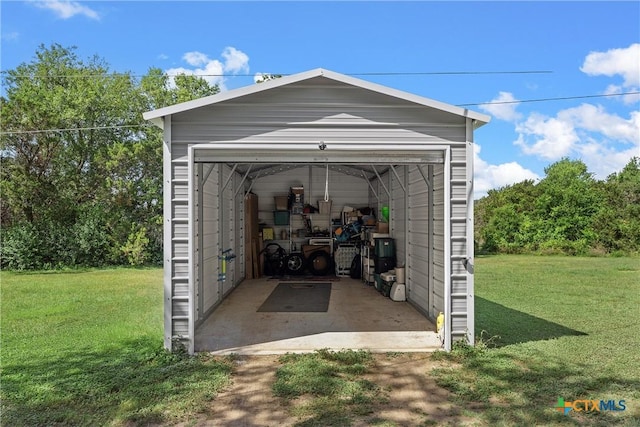 garage with a yard