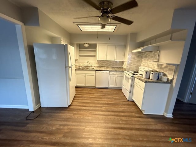 kitchen featuring white cabinetry, tasteful backsplash, dark hardwood / wood-style floors, white appliances, and exhaust hood