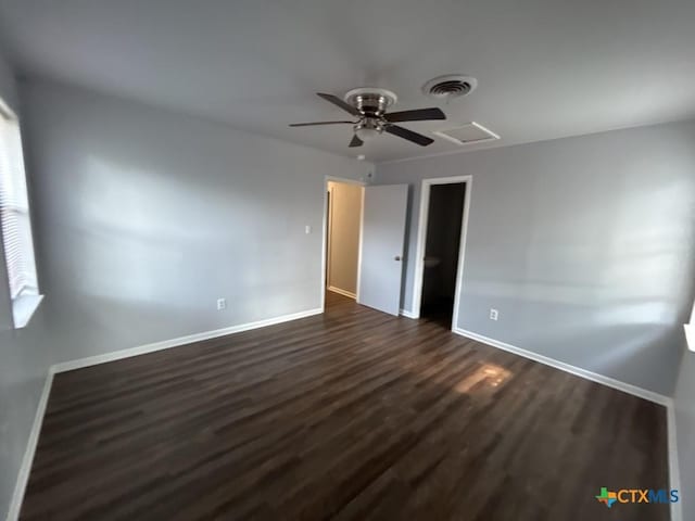 unfurnished bedroom with dark hardwood / wood-style floors and ceiling fan