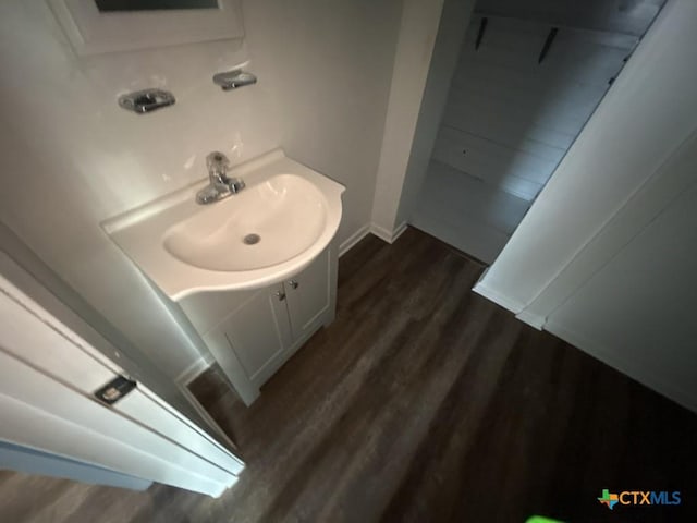 bathroom featuring vanity and wood-type flooring