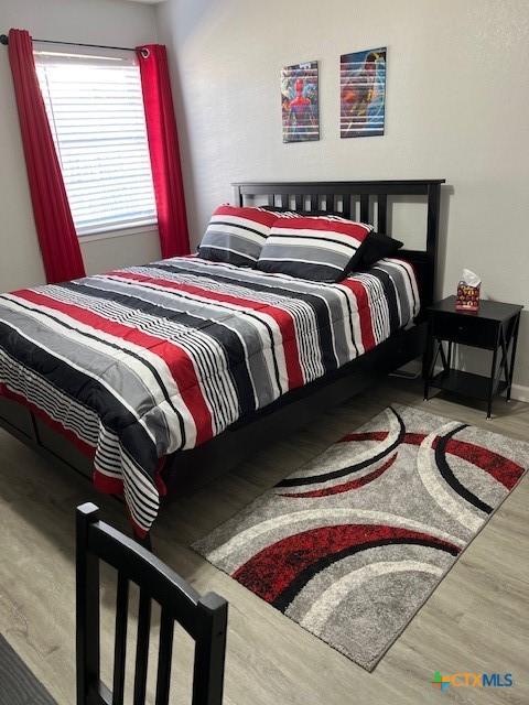 bedroom featuring hardwood / wood-style flooring