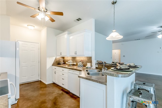 kitchen featuring pendant lighting, white cabinetry, white appliances, and kitchen peninsula