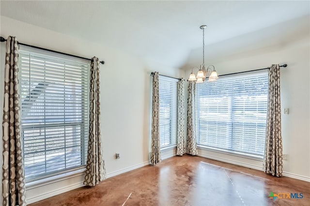 interior space with a chandelier and vaulted ceiling