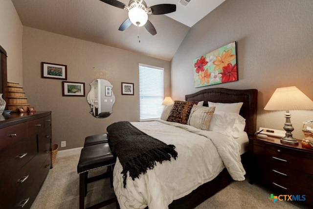 bedroom with lofted ceiling, light carpet, and ceiling fan