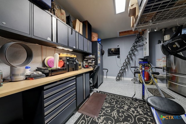 kitchen with water heater and butcher block counters