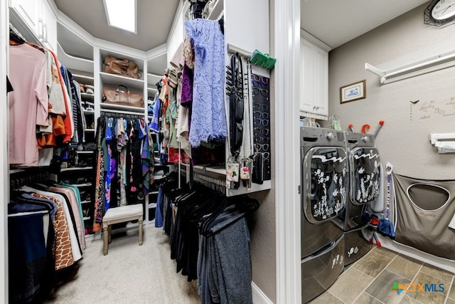 spacious closet featuring independent washer and dryer