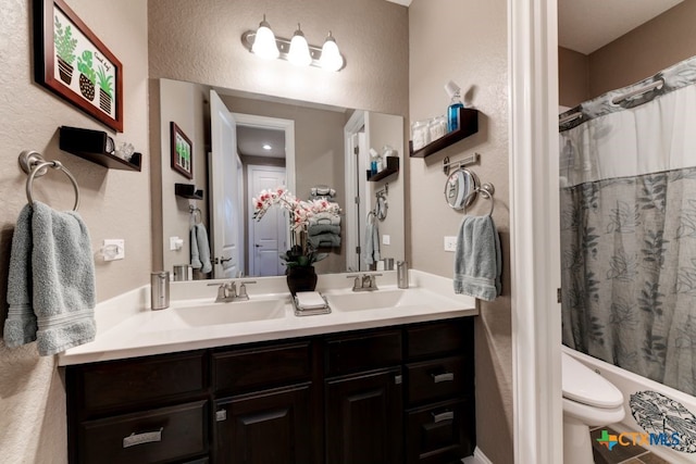 bathroom with vanity, toilet, and walk in shower